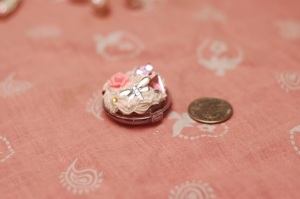 This is a Bon Bon lip gloss container with some decorations on it. I like it cause it's so tiny. 