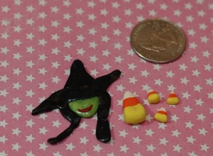 The witch is from Wicked, this was a practice version I made prior to completing the movie poster charm.  The candy corn and the wicked witch will most likely go on a Halloween themed box of some sorts. 