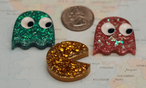 Pac-Man and Ghosty friends. I had made a Mrs. Pac-Man as well, but she got stuck to the crafting board (aka "the slab"). The Ghosties will go on keychains as is, and Pac-Man will be made to look like he is trying to eat the dots. 