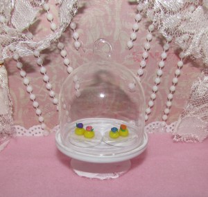 These are tiny little candy sweets for tea time. I really just wanted to make something small and yellow at the time. The doilies were also made by me. Though they are quite fragile, it's nice to have a method for creating my own miniature doilies.