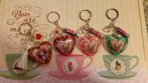 My friend at work commissioned me to make keychains for her daughters. One of the daughter;s keychain haa a picture of her baby in it. The other daughter, has 2 best friends and together they call themselves The Three Musketeers. My friend and I thought little candy bar charms would be cute on their keychains.